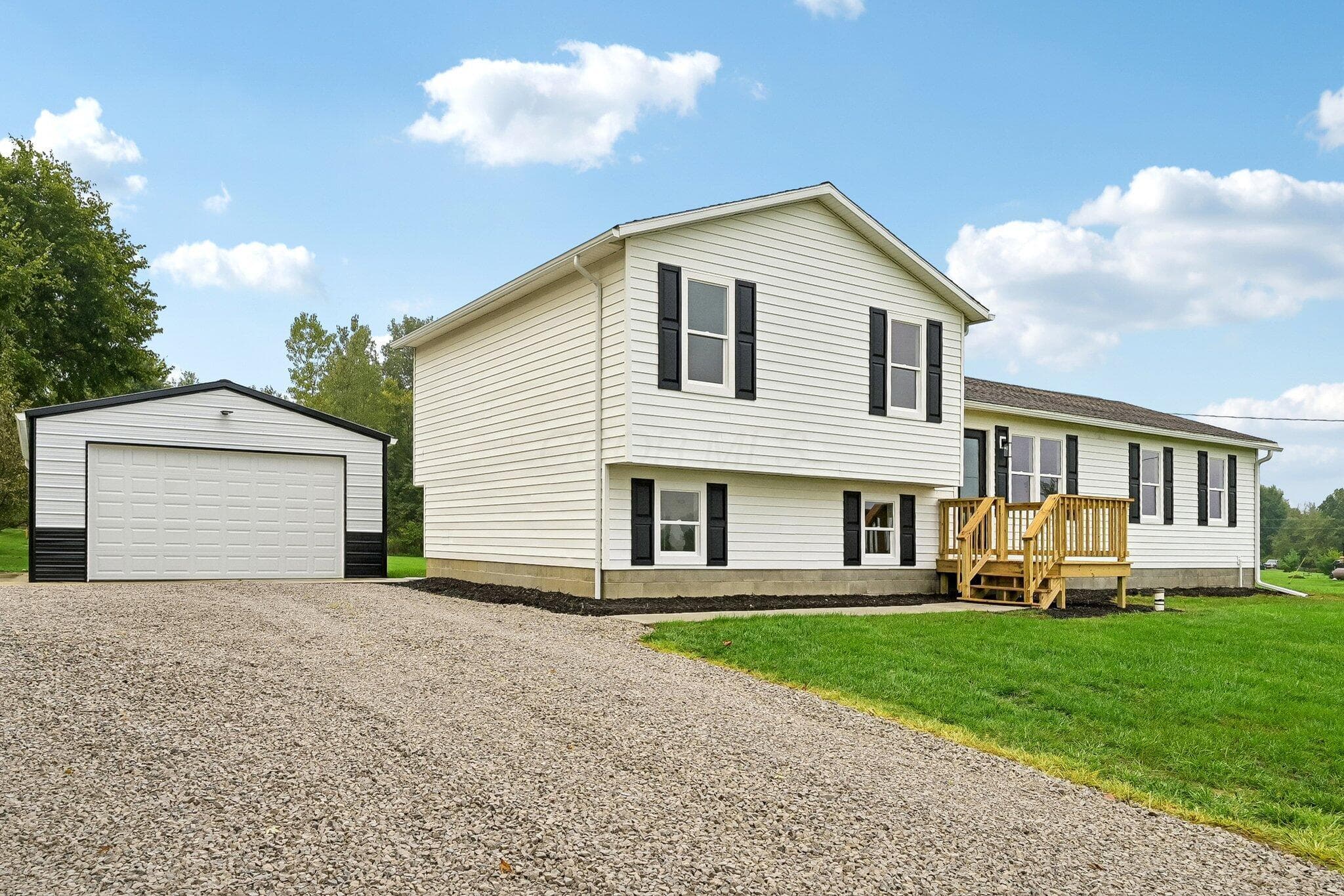 Situated on over 5.5 Acres including some woods and stream.