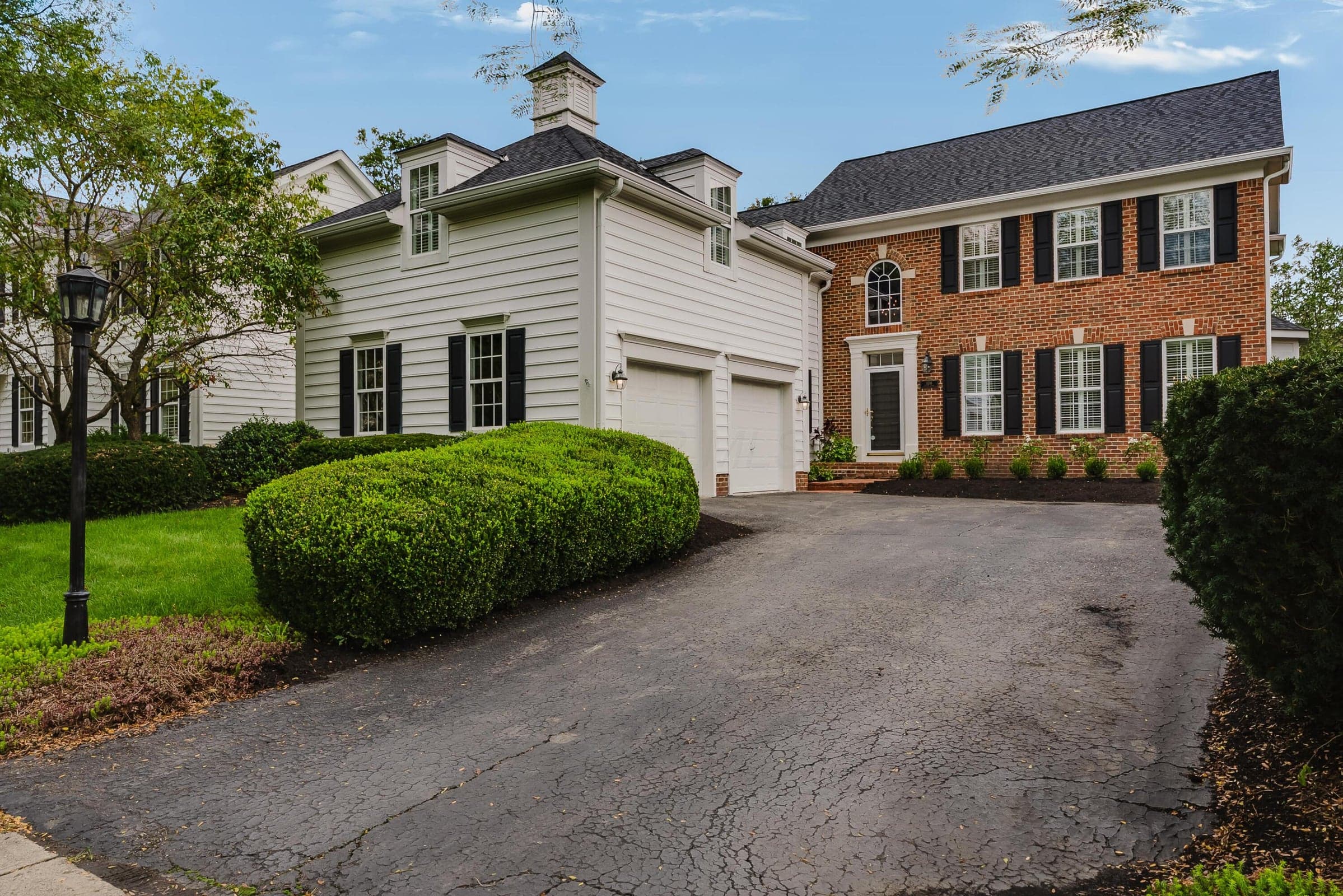 Welcoming Brick-faced Home Adorned with New Landscaping.