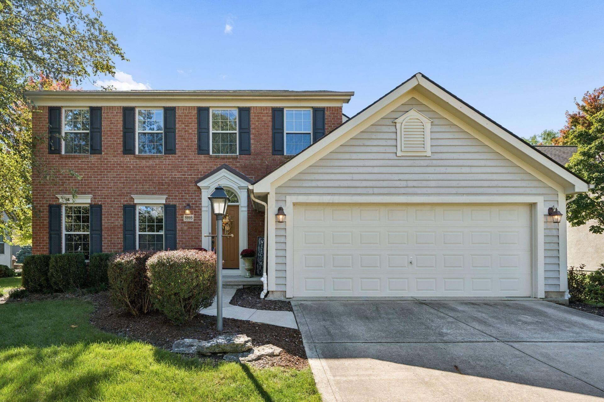 Brick and cedar natural front of home. Stucco on sides and rear