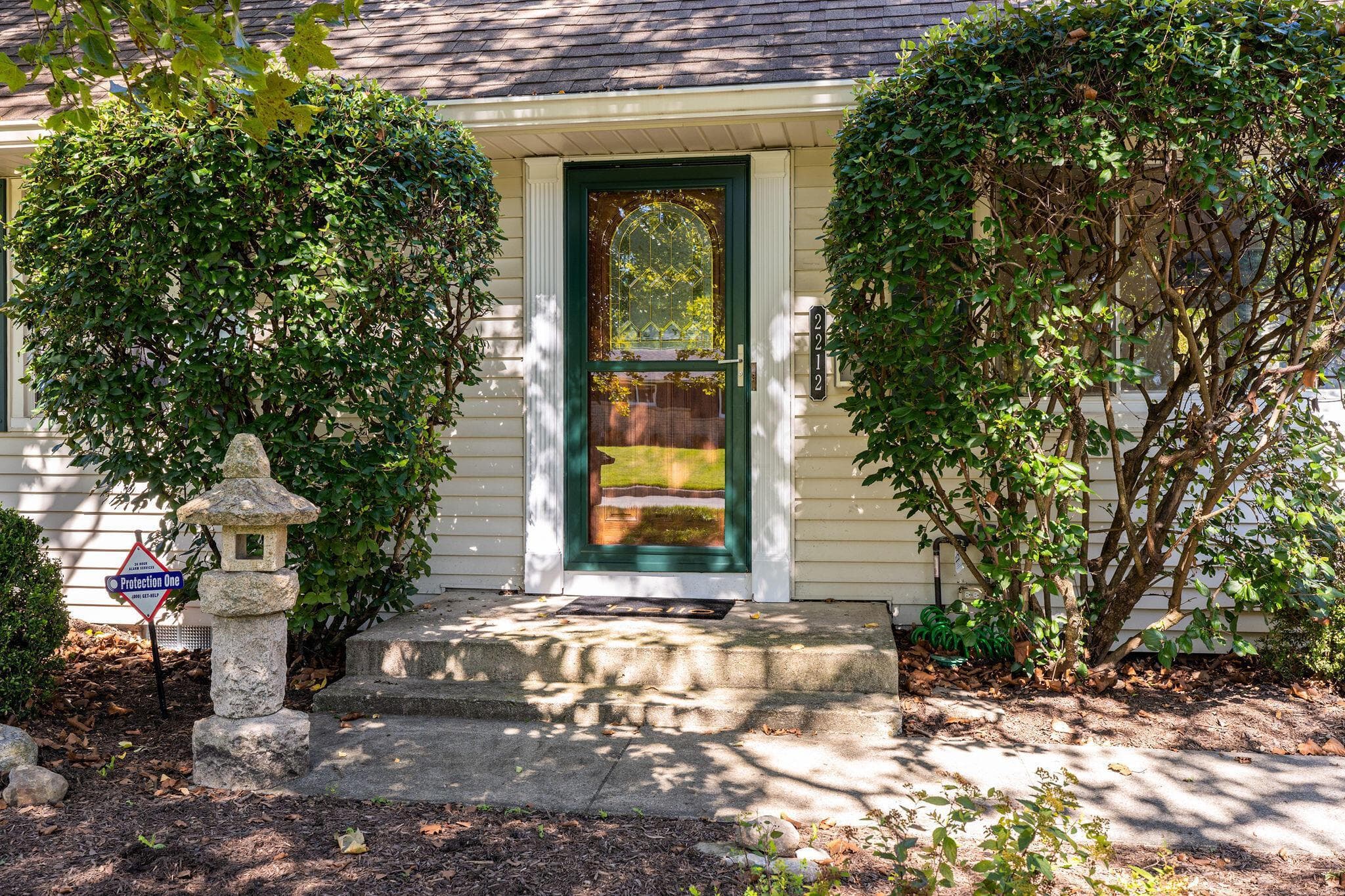 Enjoy a beautiful front entry with mature landscaping.