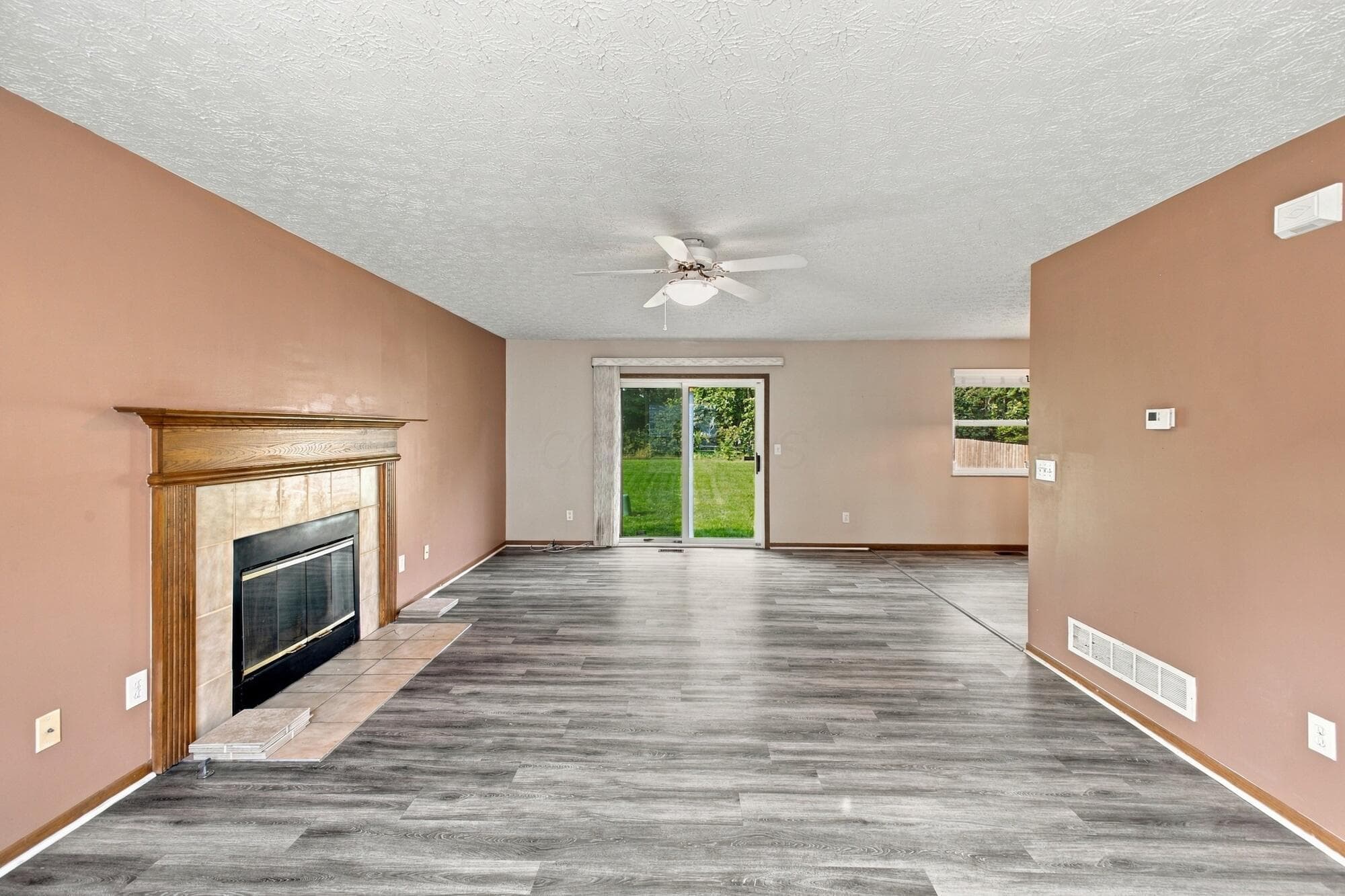 Gas fireplace, easy maintenance flooring, patio door to large backyard.