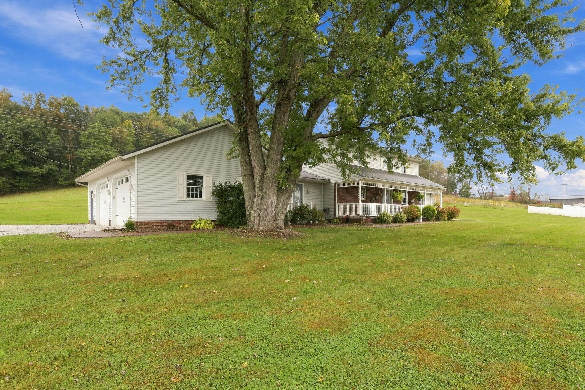 Expansive green lawn with mature shade trees