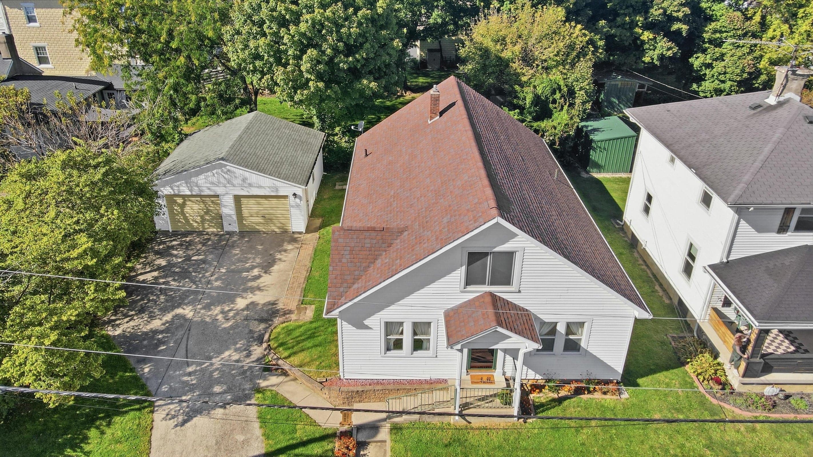 Two-car detached garage with a paved driveway