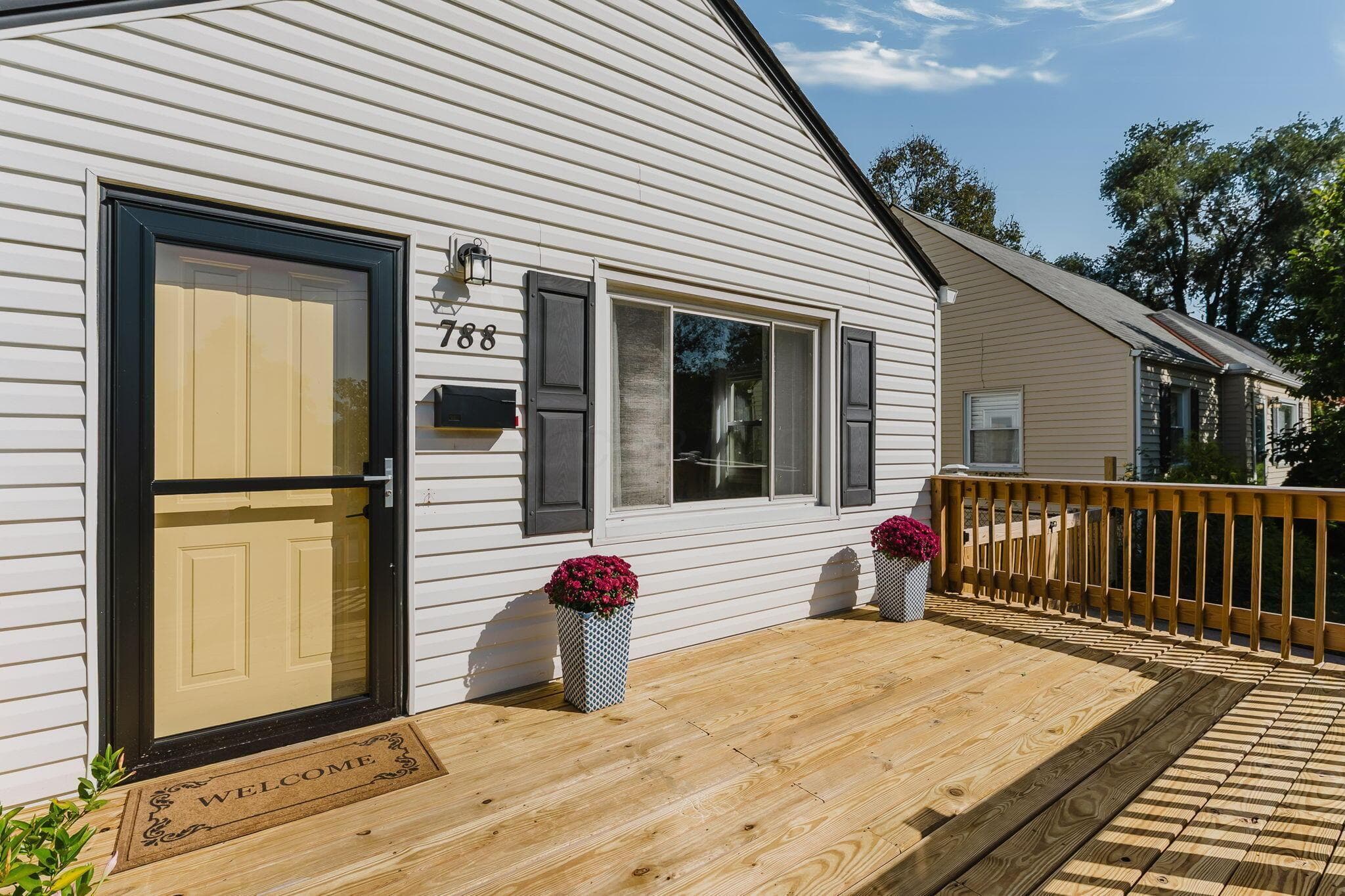 Welcoming front deck and gathering space.