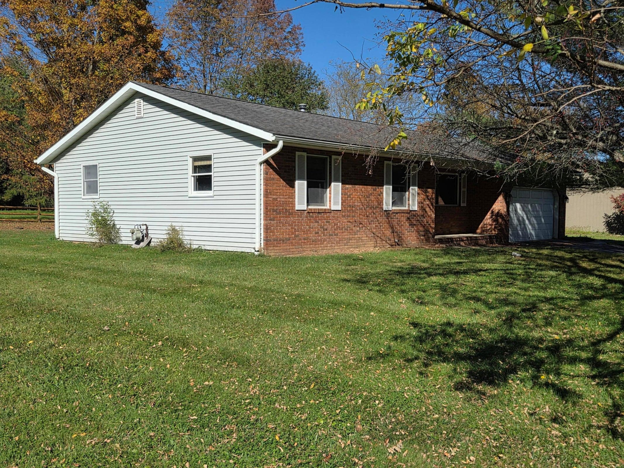 Low maintenance brick and vinyl exterior.