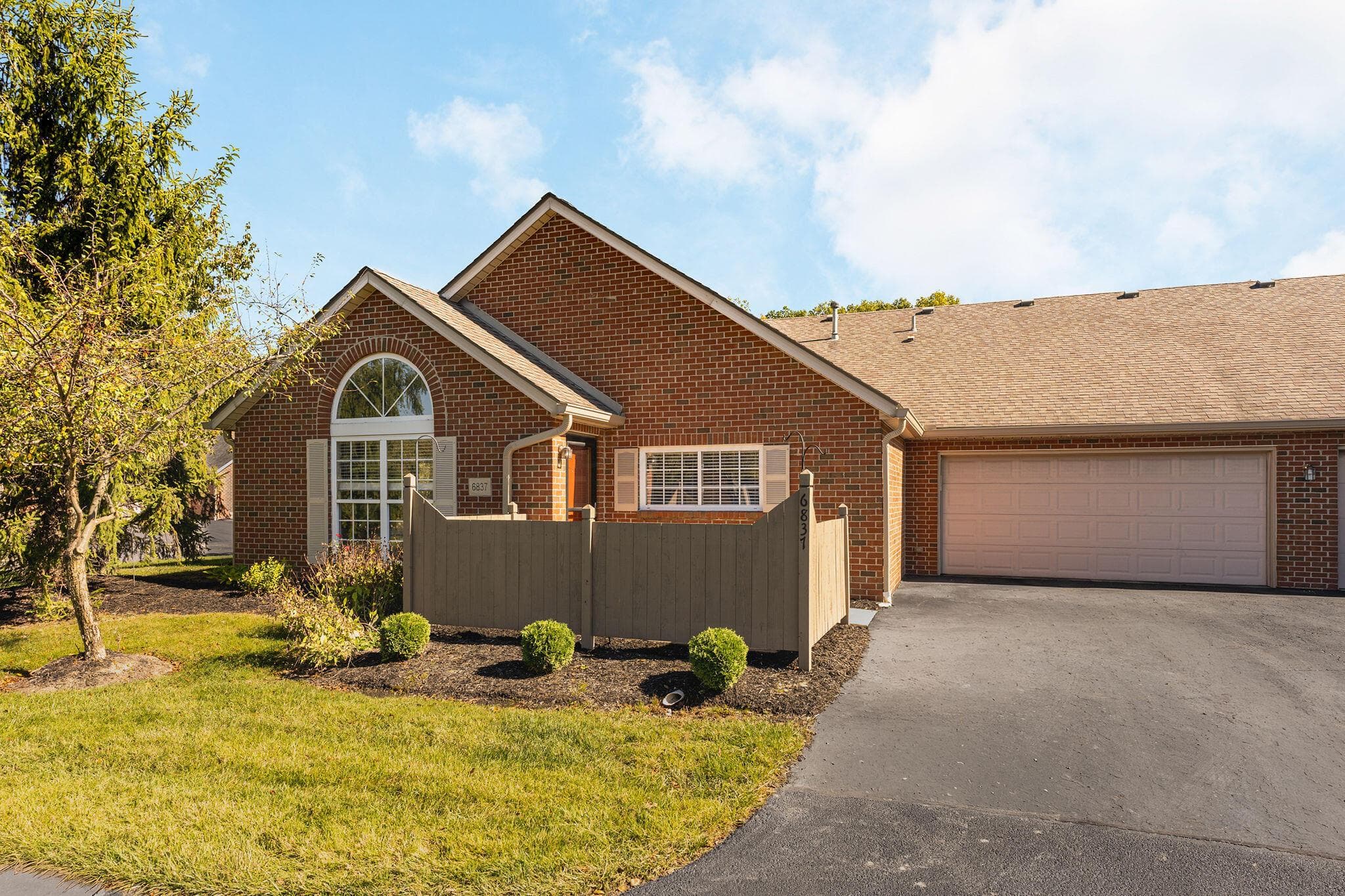 Welcome to this freshly painted and updated ranch condo with a private patio and 2-car attached and heated garage! Let's go take a look....