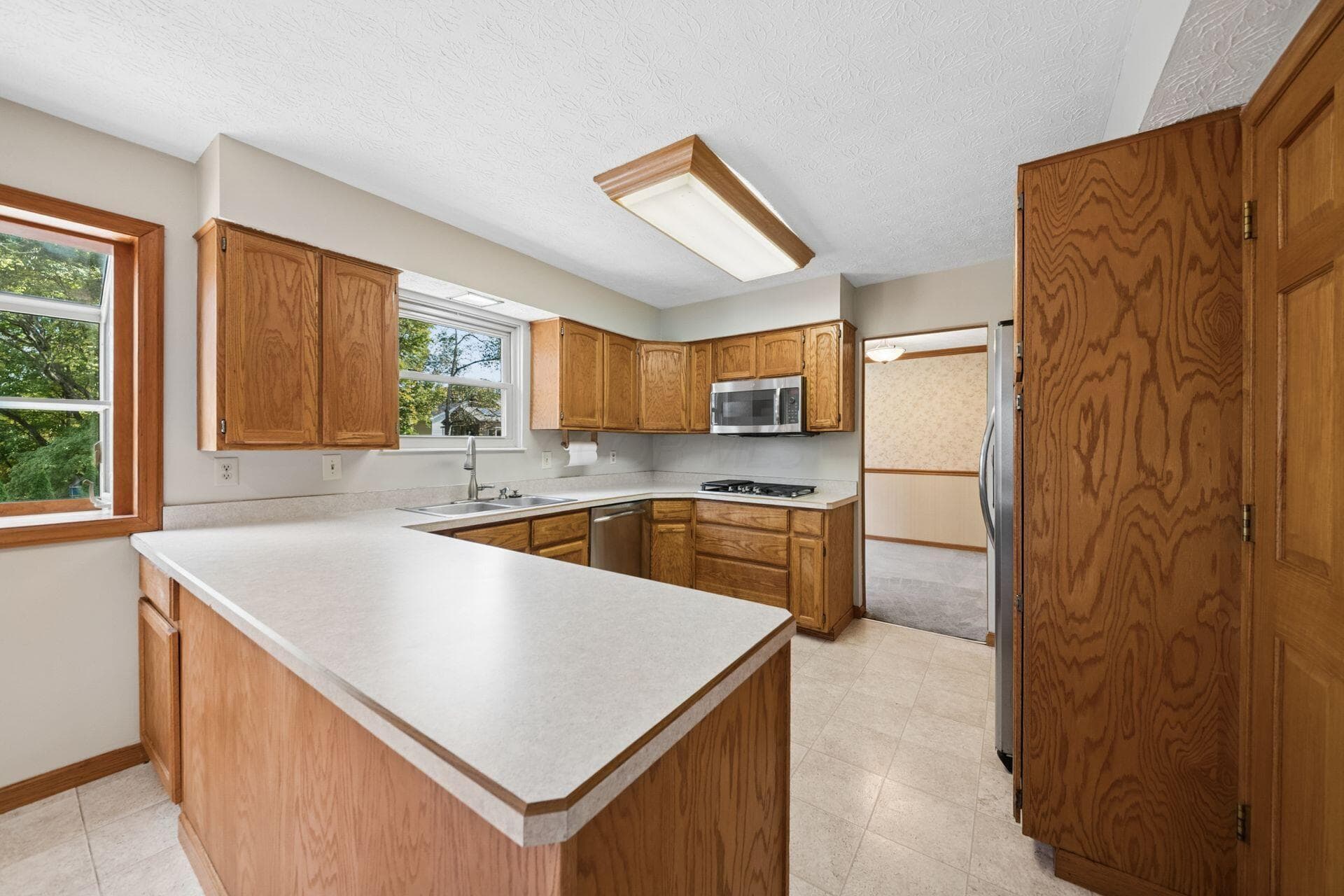 Generous counter space, a functional layout, and additional seating at the breakfast bar.