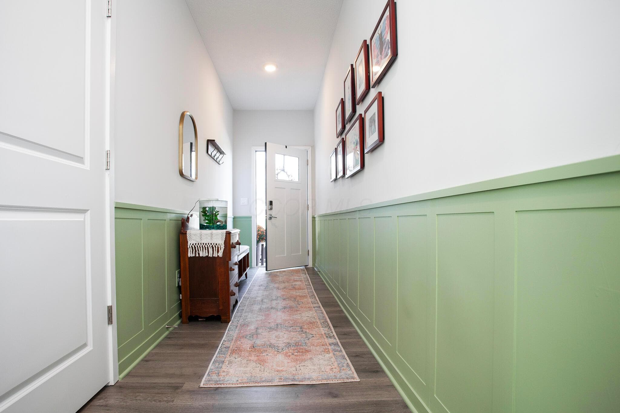 Inviting Entry with wainscot