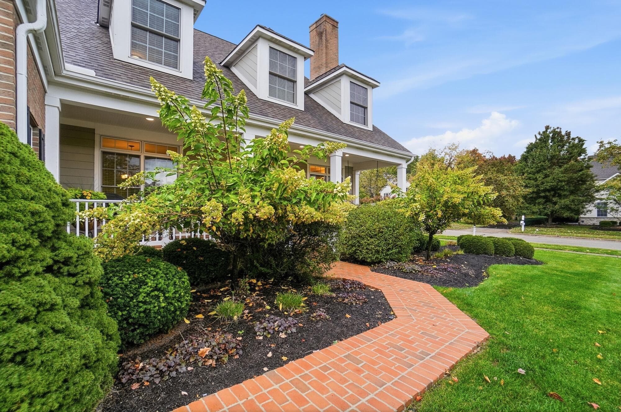 Cozy brick walkway leads to the BRICK porch!