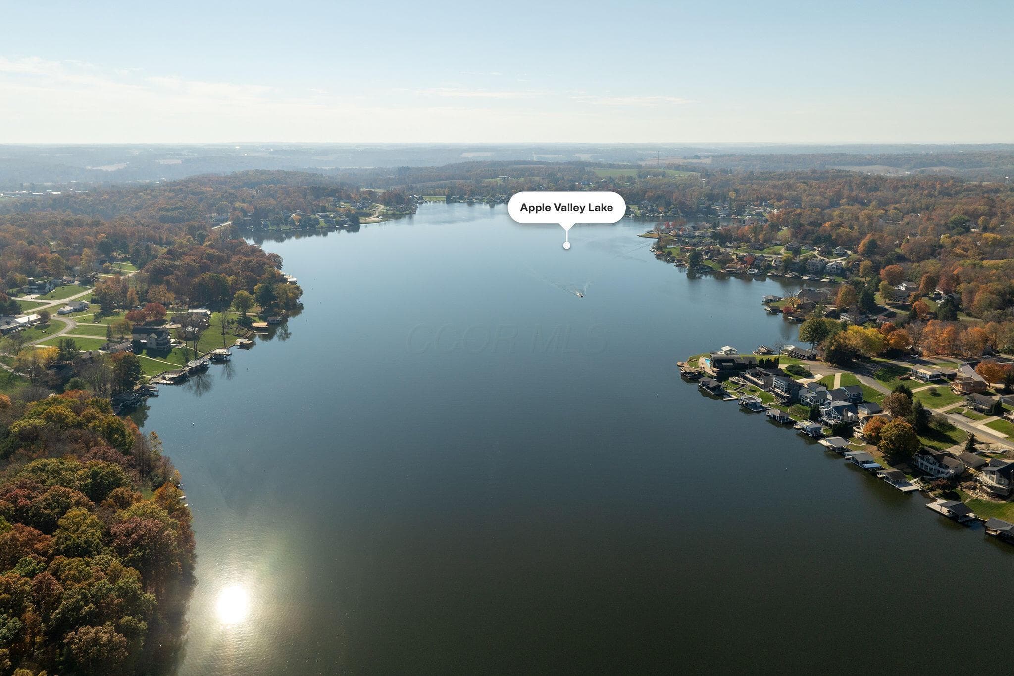 View of the coveted Apple Valley Lake in Howard, OH! Enjoy resident lake access, 3 beach areas, 2 swimming pools and parks close by offering a wonderful resort lifestyle.