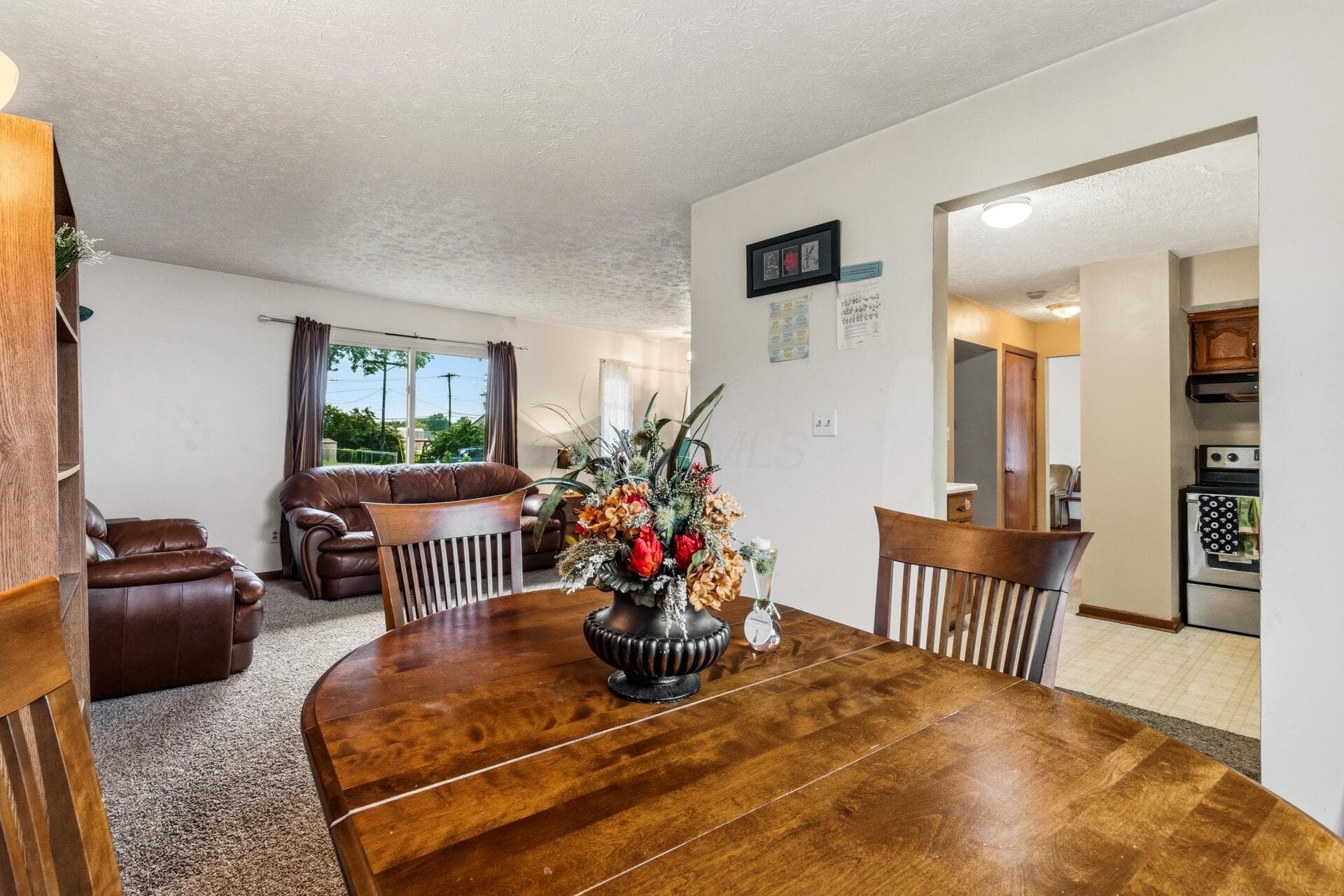 Located off ethe living room and kitchen this roomy dining room is super convenient.