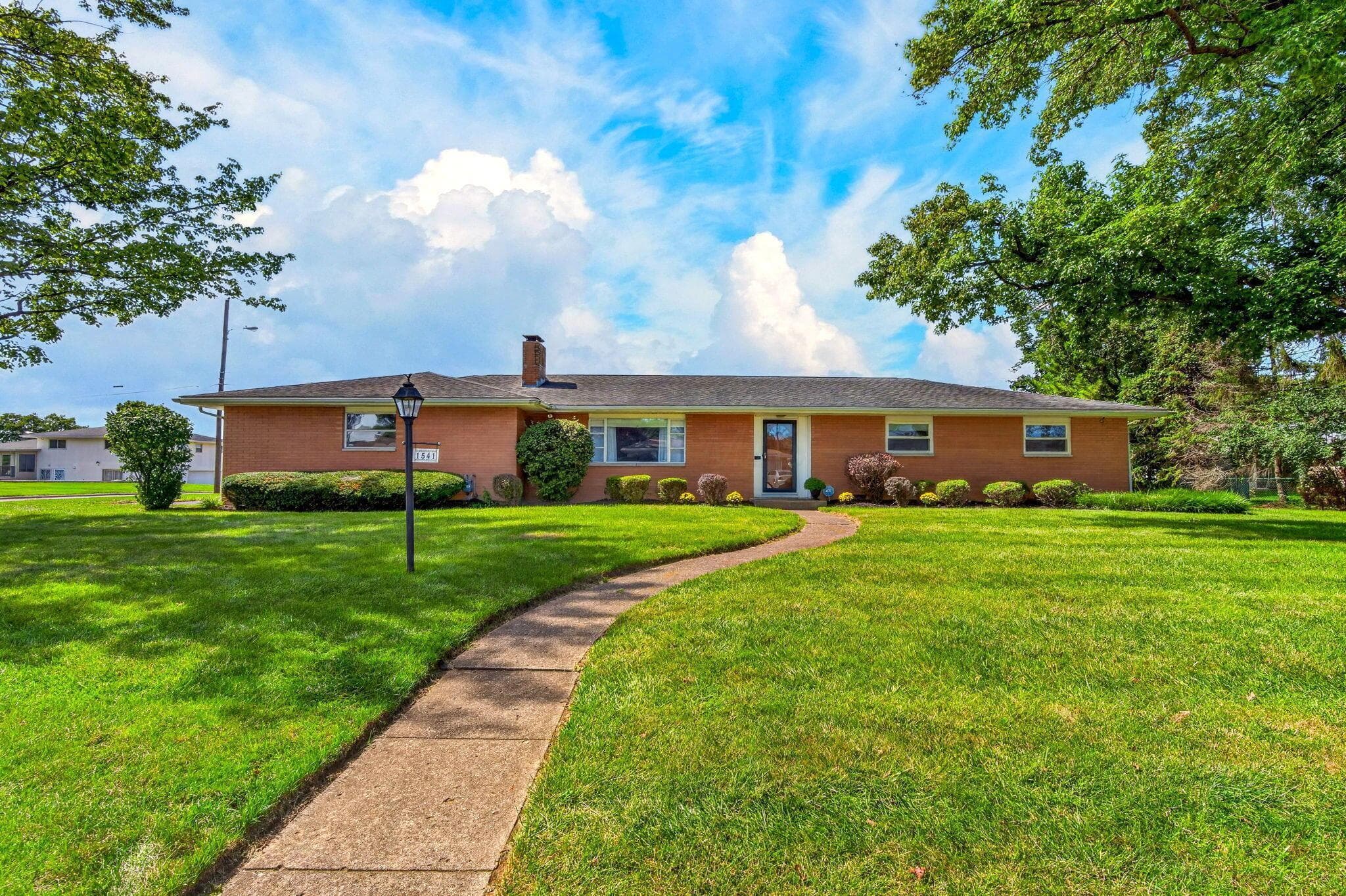 Classic 1957 brick ranch in Columbus’ Berwick neighborhood, surrounded by mature trees and beautiful landscaping.