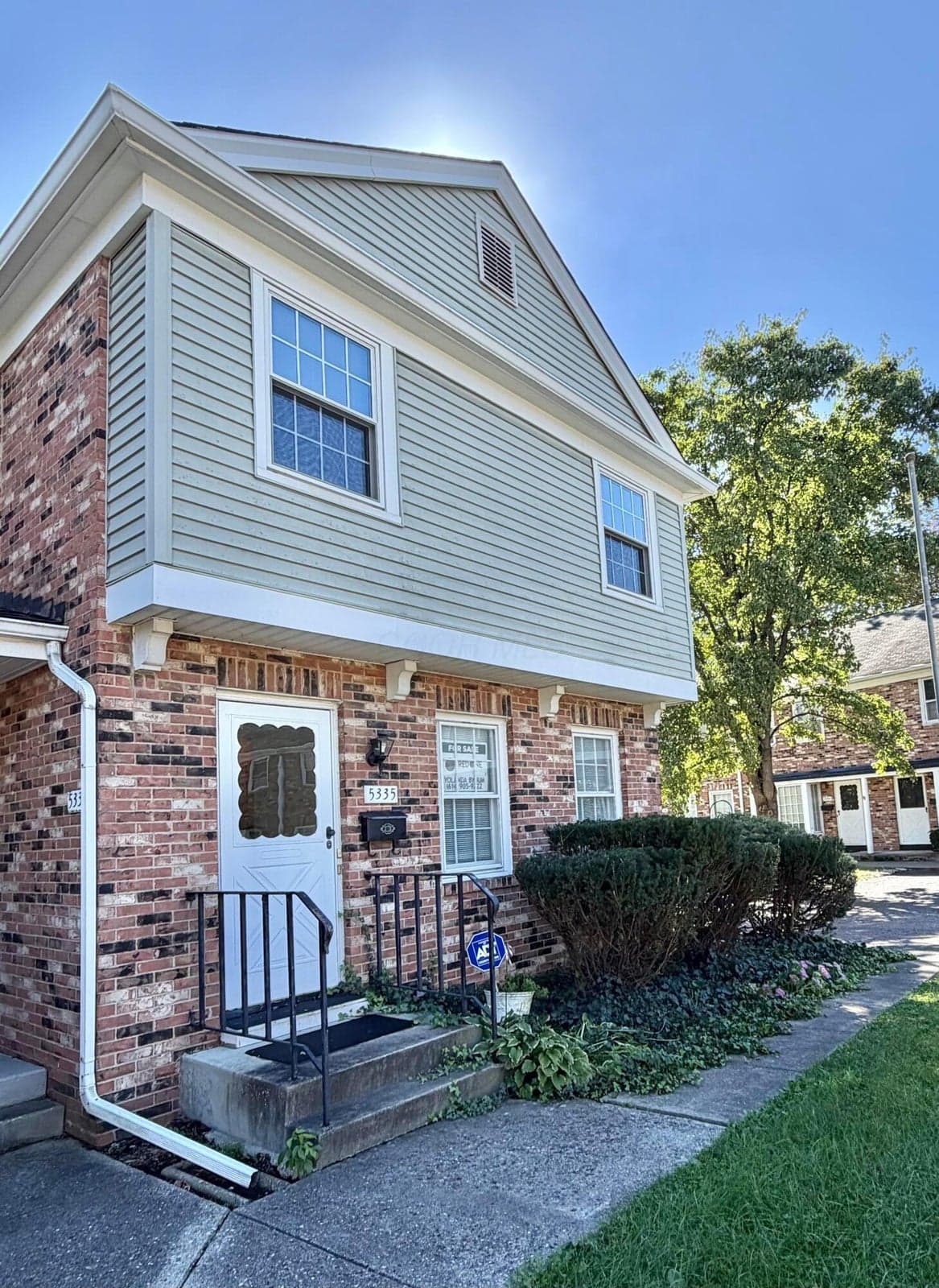 Brick and siding exterior with gabled roofline